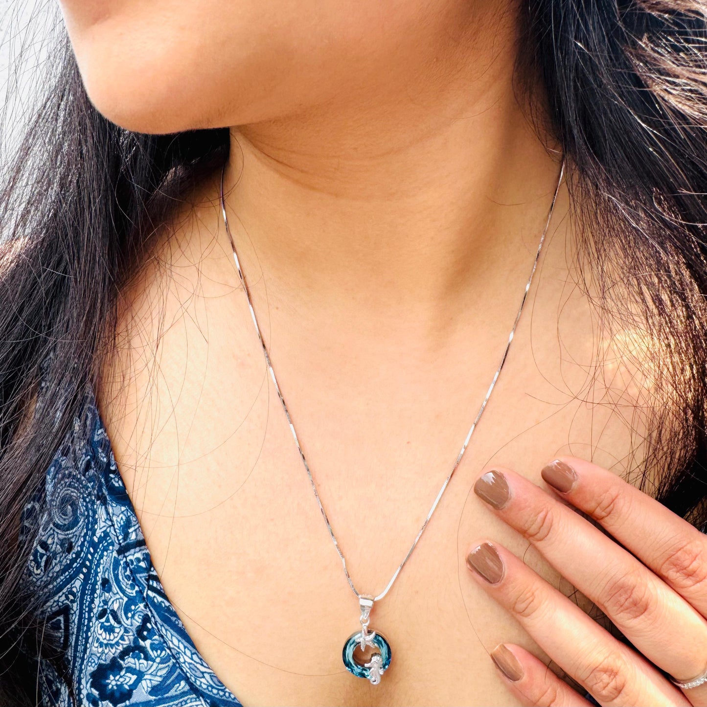 Male seahorse necklace on our model