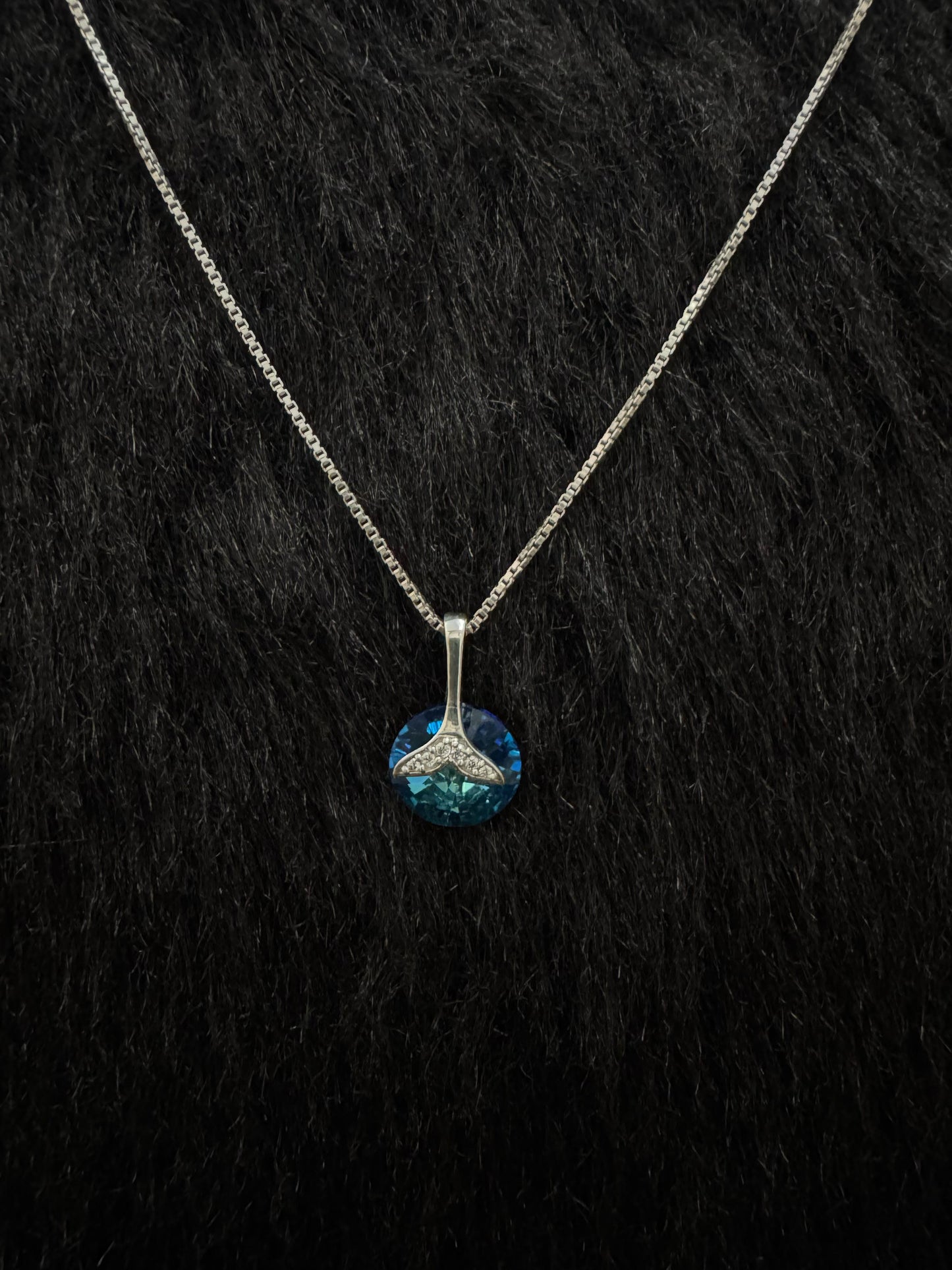 A Sterling Silver Pendant with Blue Stone