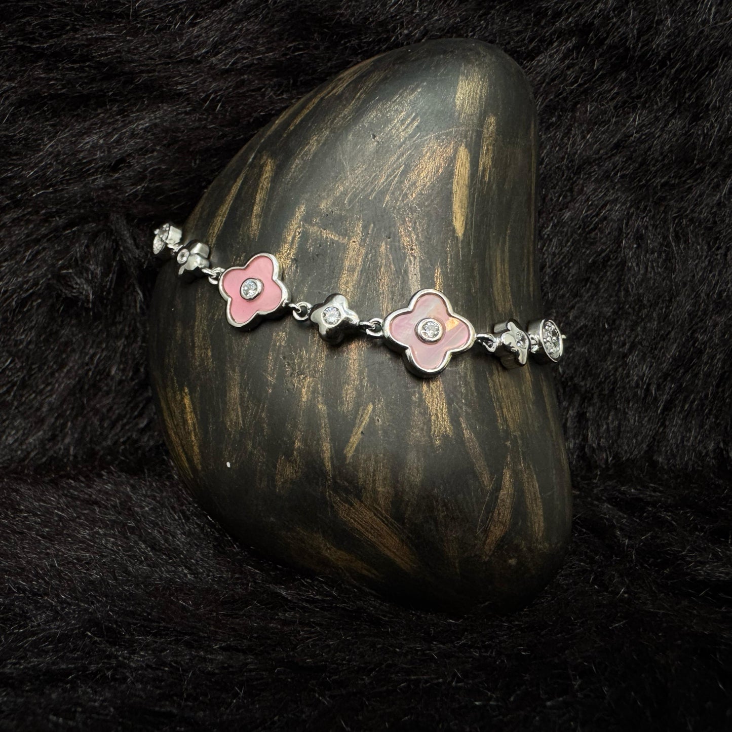 Sterling silver bracelet with enamel pink flower charms and zircon accents