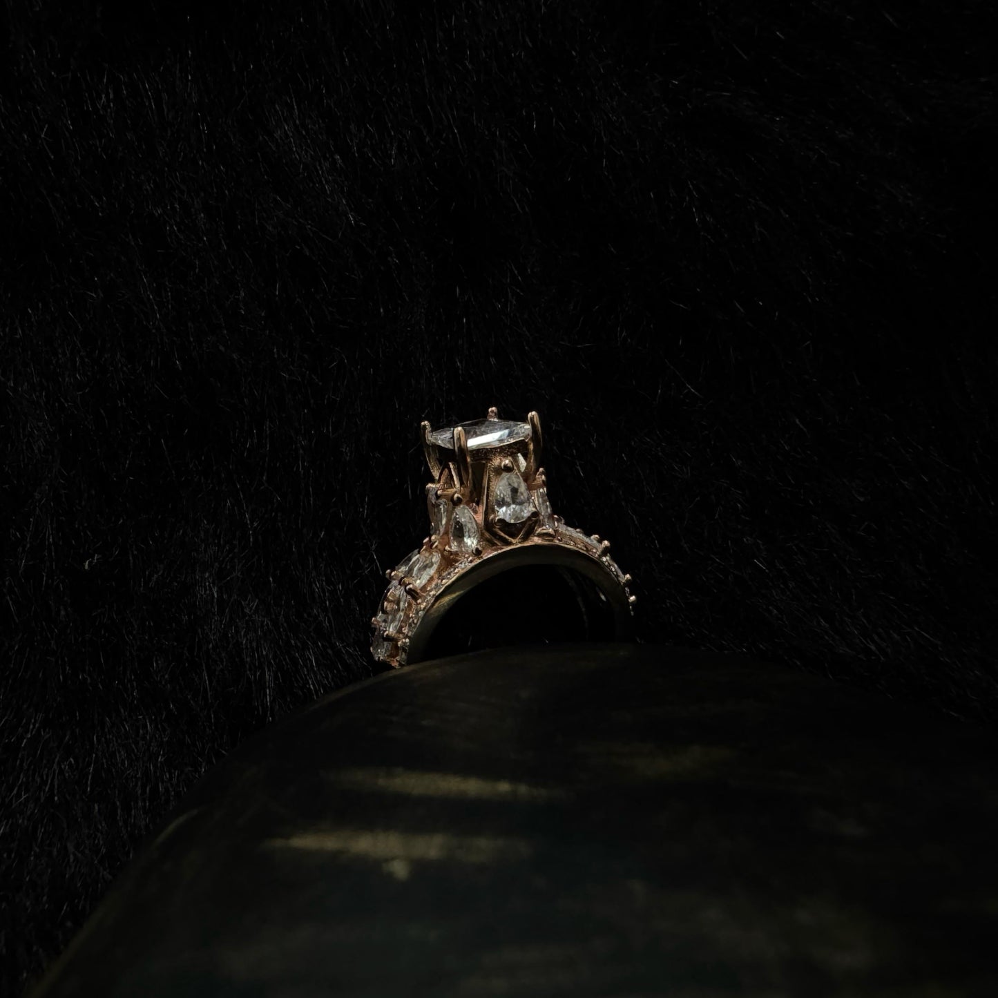 Elegant rose gold-plated 925 silver ring with a raised radiant-cut center stone and teardrop zirconia accents