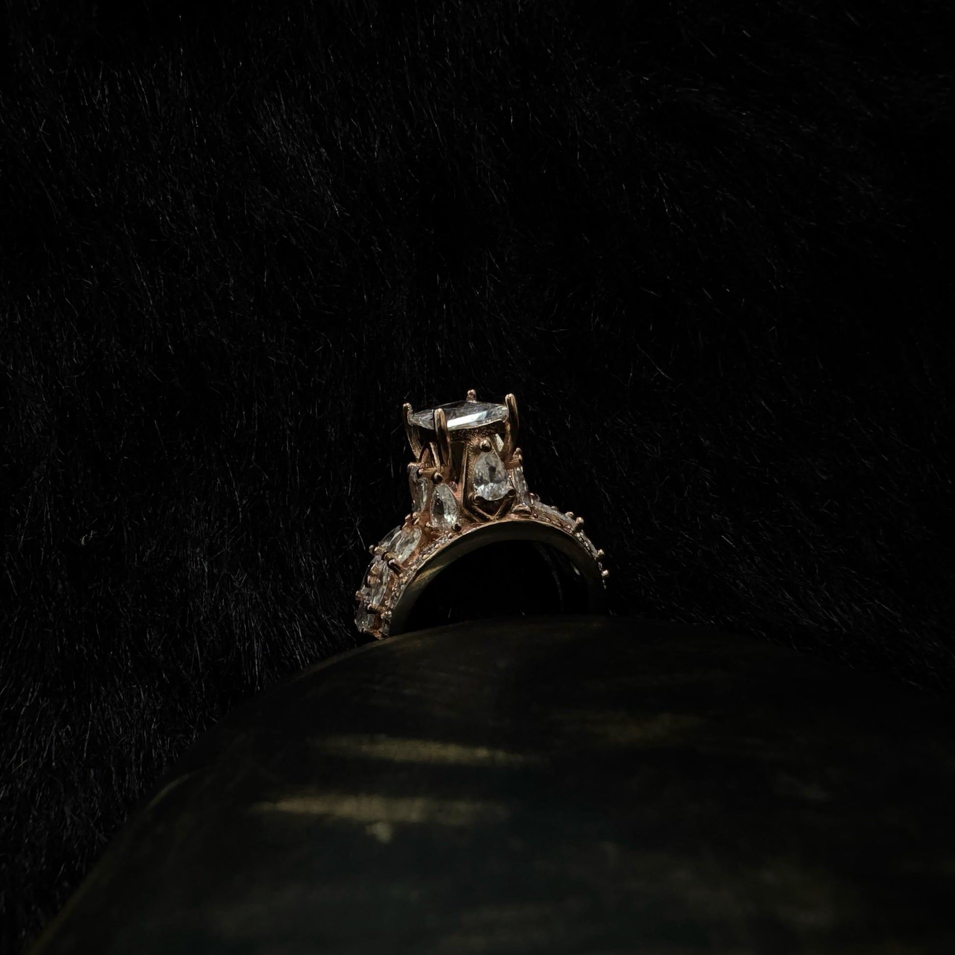 Elegant rose gold-plated 925 silver ring with a raised radiant-cut center stone and teardrop zirconia accents