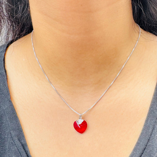 Our flaming heart necklace on a model
