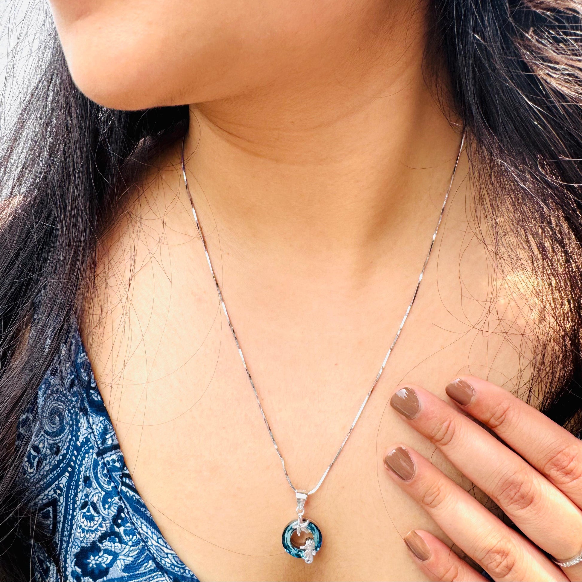Male seahorse necklace on our model