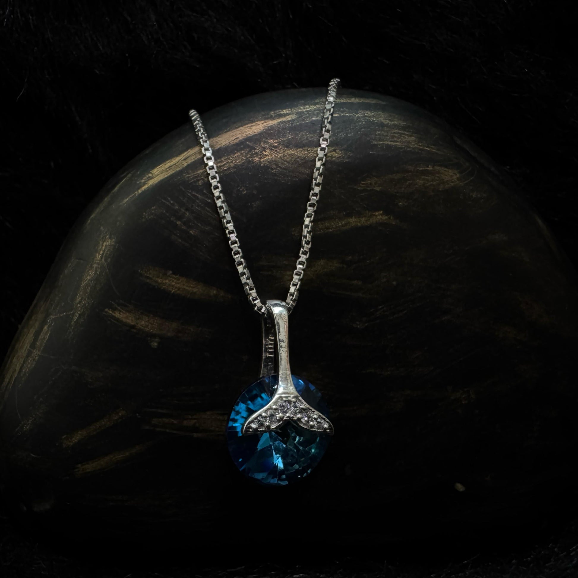 A Sterling Silver Pendant with Blue Stone