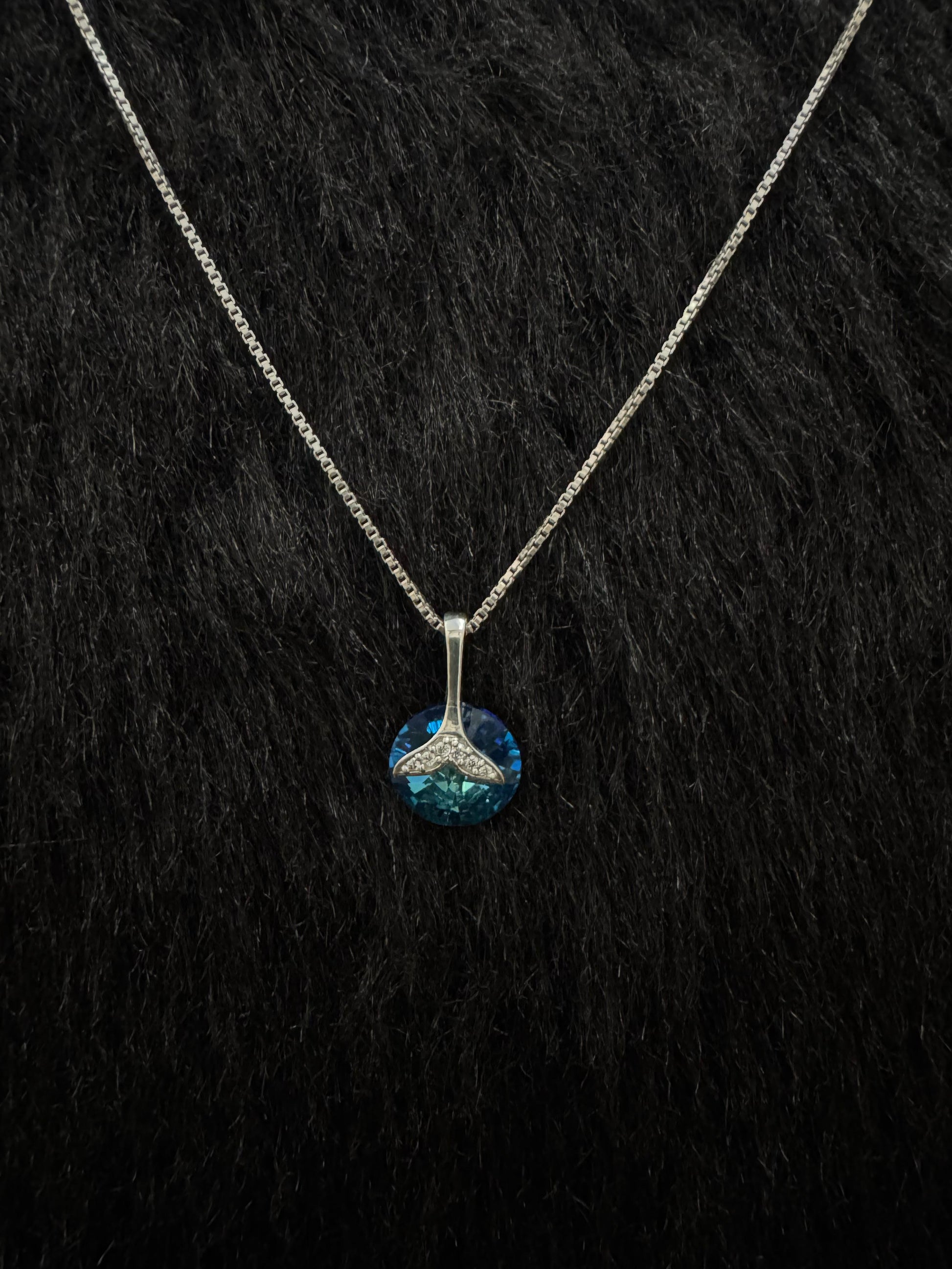 A Sterling Silver Pendant with Blue Stone