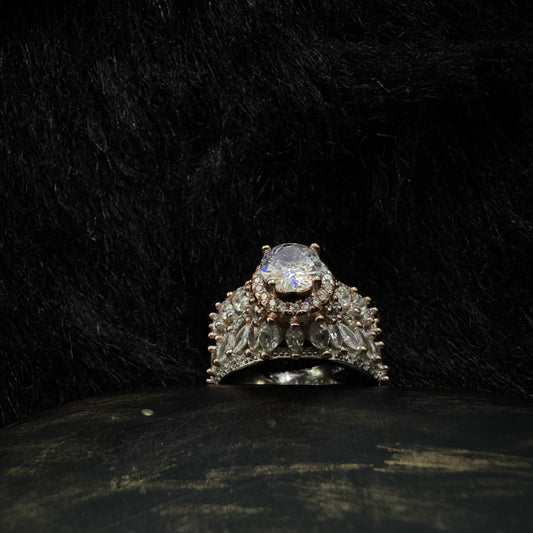 A luxurious 92.5 sterling silver crown ring with marquise and round-cut cubic zirconia stones, set against a dark background for a dramatic, regal look