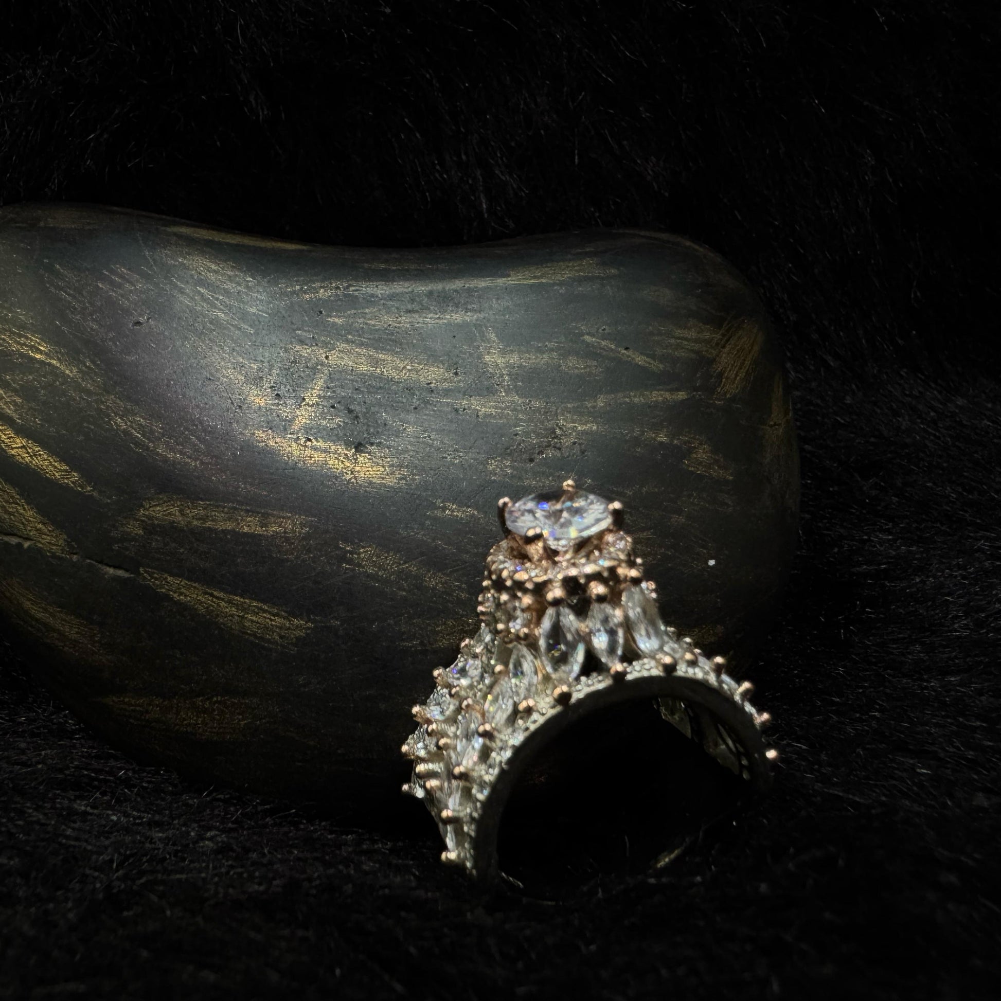A luxurious 92.5 sterling silver crown ring with marquise and round-cut cubic zirconia stones, set against a dark background for a dramatic, regal look